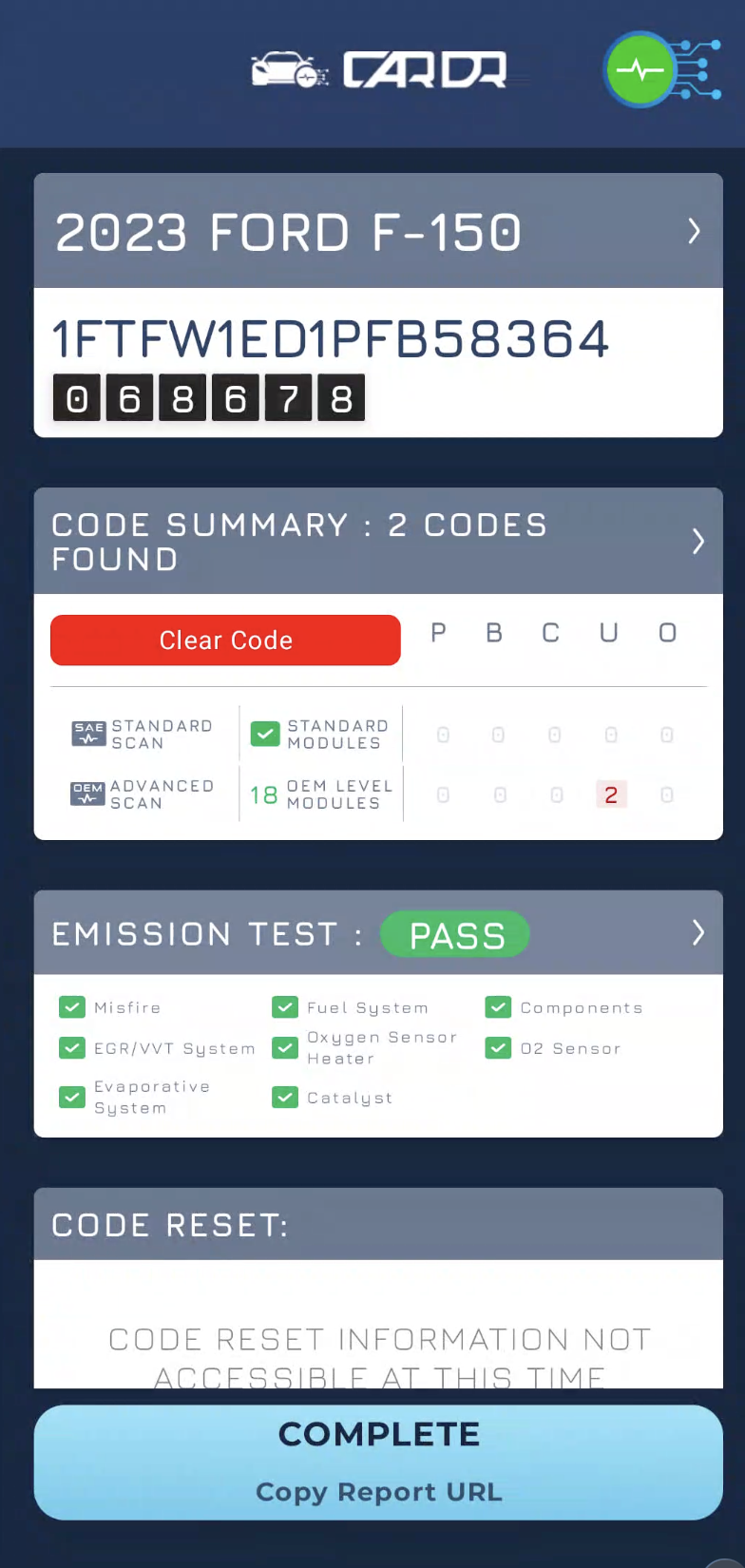 Completed scan summary for a 2023 Ford F-150 showing two codes, emission test pass, and code reset status